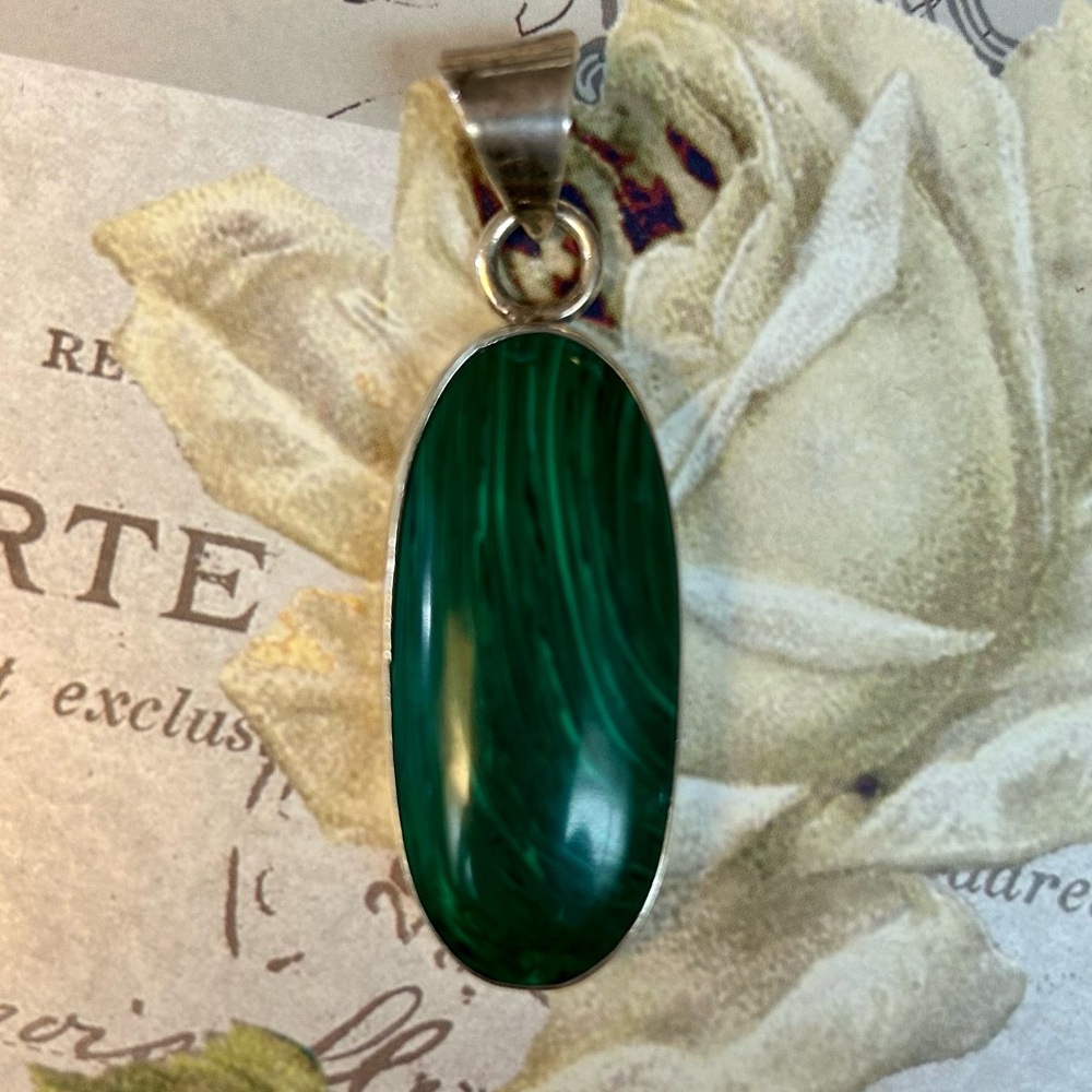 Gorgeous elongated malachite set in solid silver with heavy bail